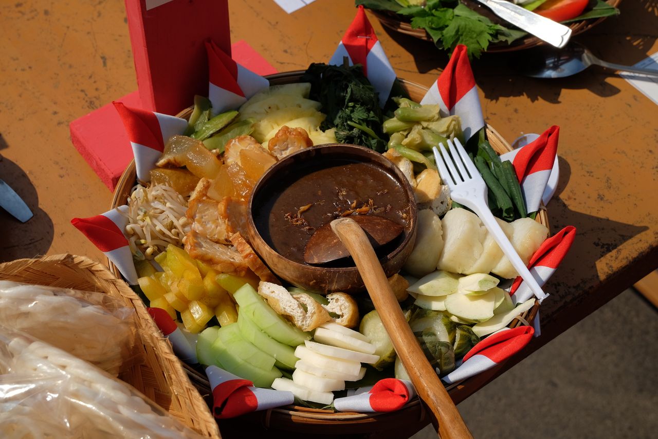 Crafting Captivating Headlines: Your awesome post title goes here Delicious Indonesian traditional salad with peanut sauce captured in vibrant colors outdoors.